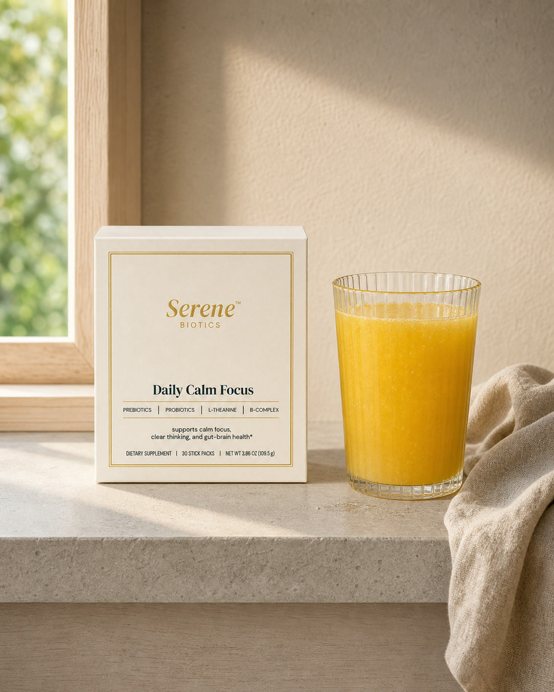 The morning: the cream Daily Calm Focus carton and the golden drink in early light