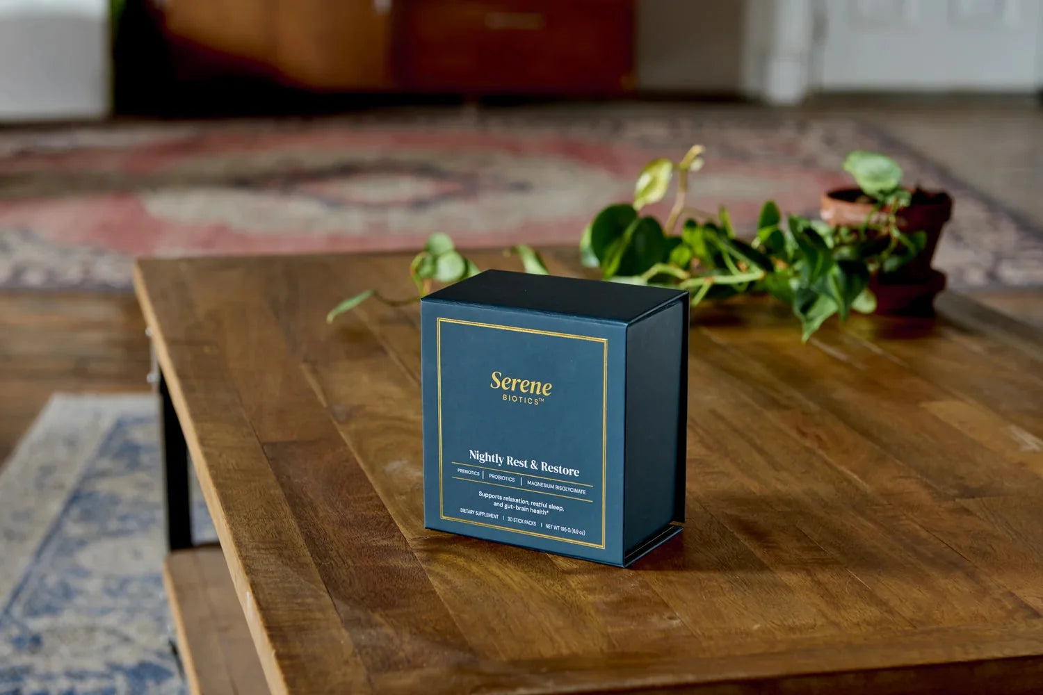 The Nightly Rest & Restore carton on a wooden table at home