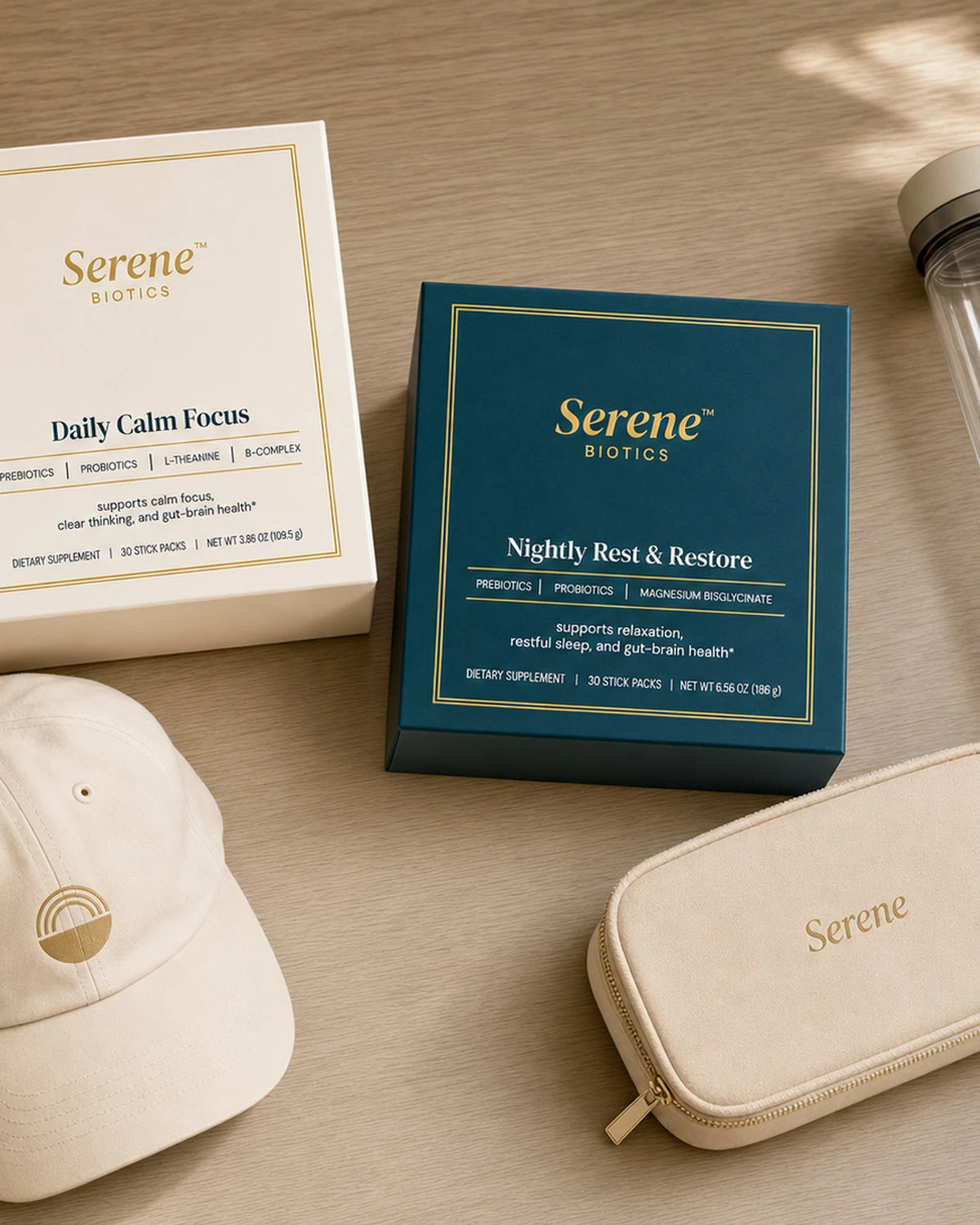 The Serene Biotics welcome kit: cap, insulated bottle, and vegan-leather pouch in a teal keepsake box